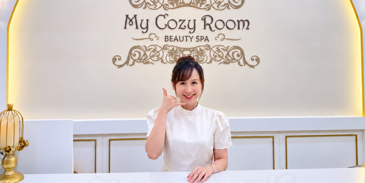 A smiling My Cozy Room team member welcoming visitors at reception
